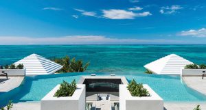 Cascade terraces over three levels. Each bedroom offers direct access to either a swiming pool or the beach.